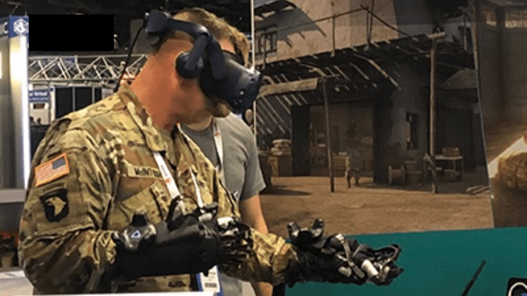 Military user tests the TC3Sim haptics scenario integrated with the HaptX glove system. 
